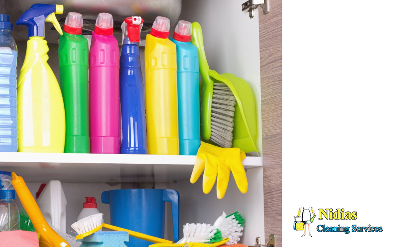 Cleaning tools neatly organized on shelves.